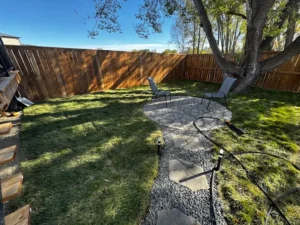 Backyard stone walkway and fire place landscaping project