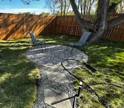 Backyard stone walkway and fire place landscaping project