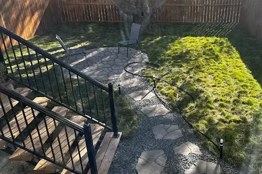 Backyard stone walkway and fire place landscaping project