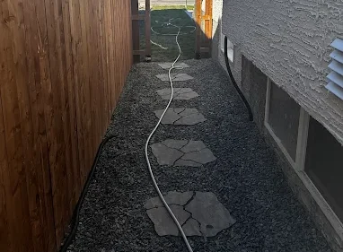 walkway path next to residential house hardscaping project